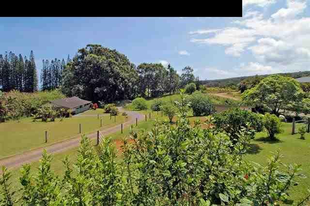 260 Awalau Road Haiku, HI 96708 - Photo 28 of 30 a view of a lake with a building in the background