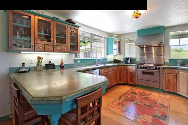 260 Awalau Road Haiku, HI 96708 - Photo 4 of 30 a kitchen with stainless steel appliances granite countertop a sink and a stove