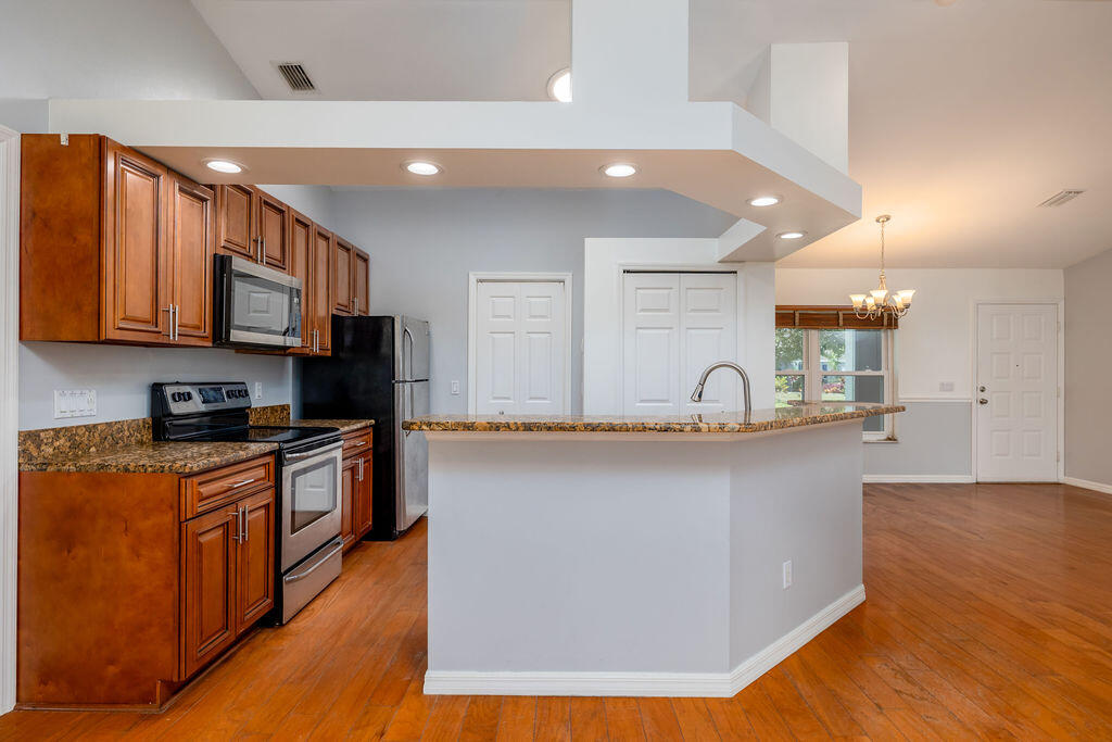 4365 Southwest Appleseed Road Port St. Lucie, FL 34953 - Photo 8 of 21 Kitchen and Foyer