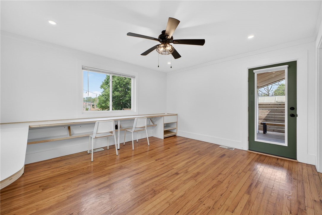 21 Haynes Street Piedmont, SC 29673 - Photo 14 of 35 This bright space features sleek built-in desks, rich hardwood floors, and a private outdoor deck access.