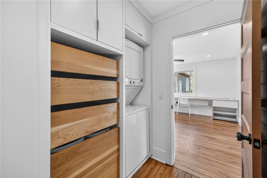 21 Haynes Street Piedmont, SC 29673 - Photo 15 of 35 This thoughtfully designed laundry area maximizes space with stacked appliances and convenient storage.