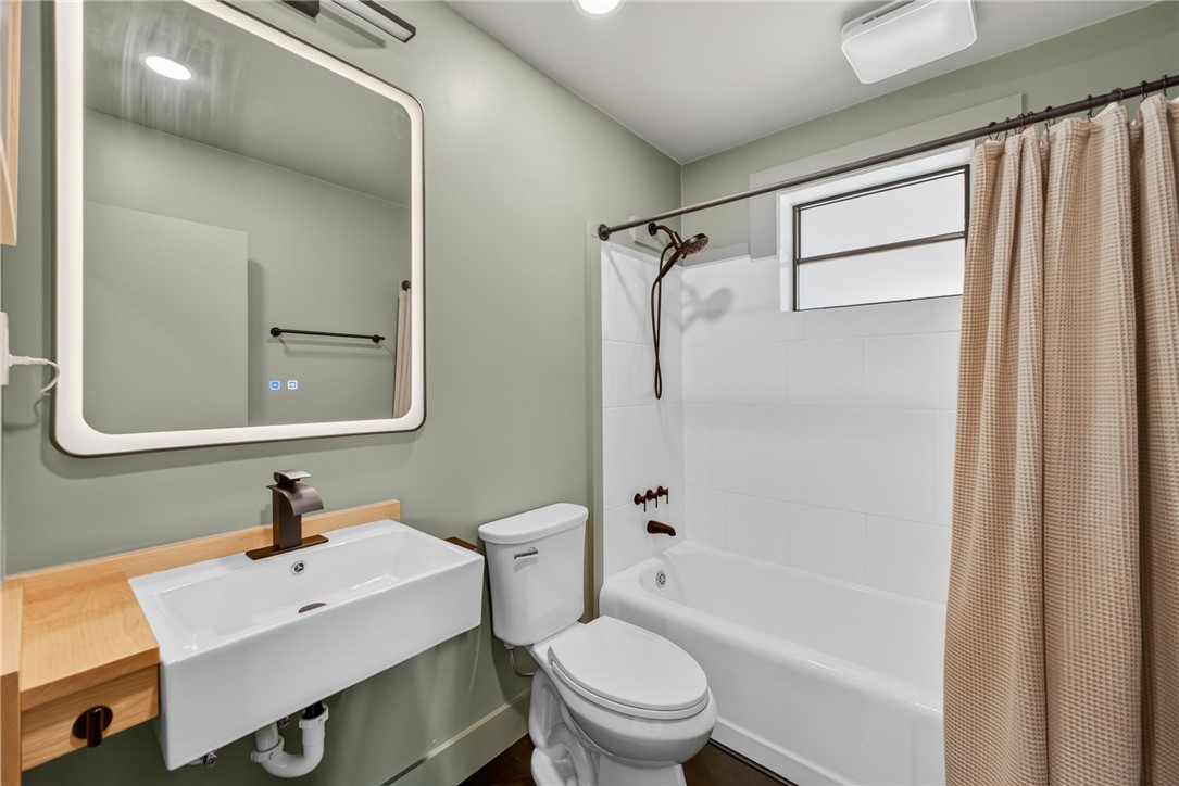 21 Haynes Street Piedmont, SC 29673 - Photo 16 of 35 This updated bathroom features a sleek vanity and modern fixtures.