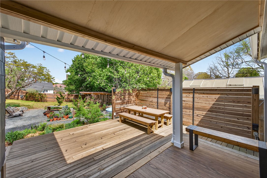 21 Haynes Street Piedmont, SC 29673 - Photo 17 of 35 Enjoy outdoor living on this expansive wooden deck, perfect for relaxation and gatherings.
