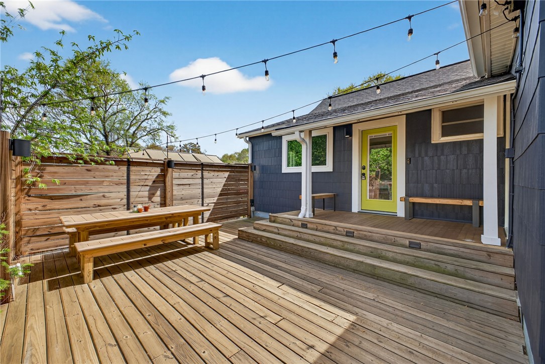 21 Haynes Street Piedmont, SC 29673 - Photo 18 of 35 An inviting outdoor space featuring a spacious wooden deck perfect for gatherings and relaxation.