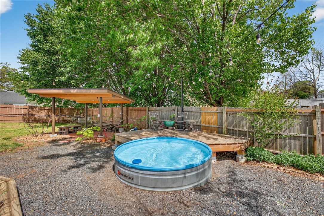 21 Haynes Street Piedmont, SC 29673 - Photo 22 of 35 This private outdoor space features a charming patio with a small pool, perfect for relaxation.