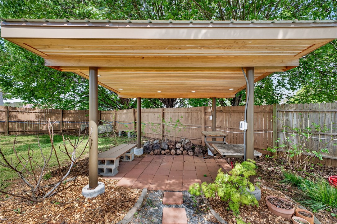 21 Haynes Street Piedmont, SC 29673 - Photo 23 of 35 Enjoy outdoor living with this covered patio area, perfect for relaxation and entertainment.