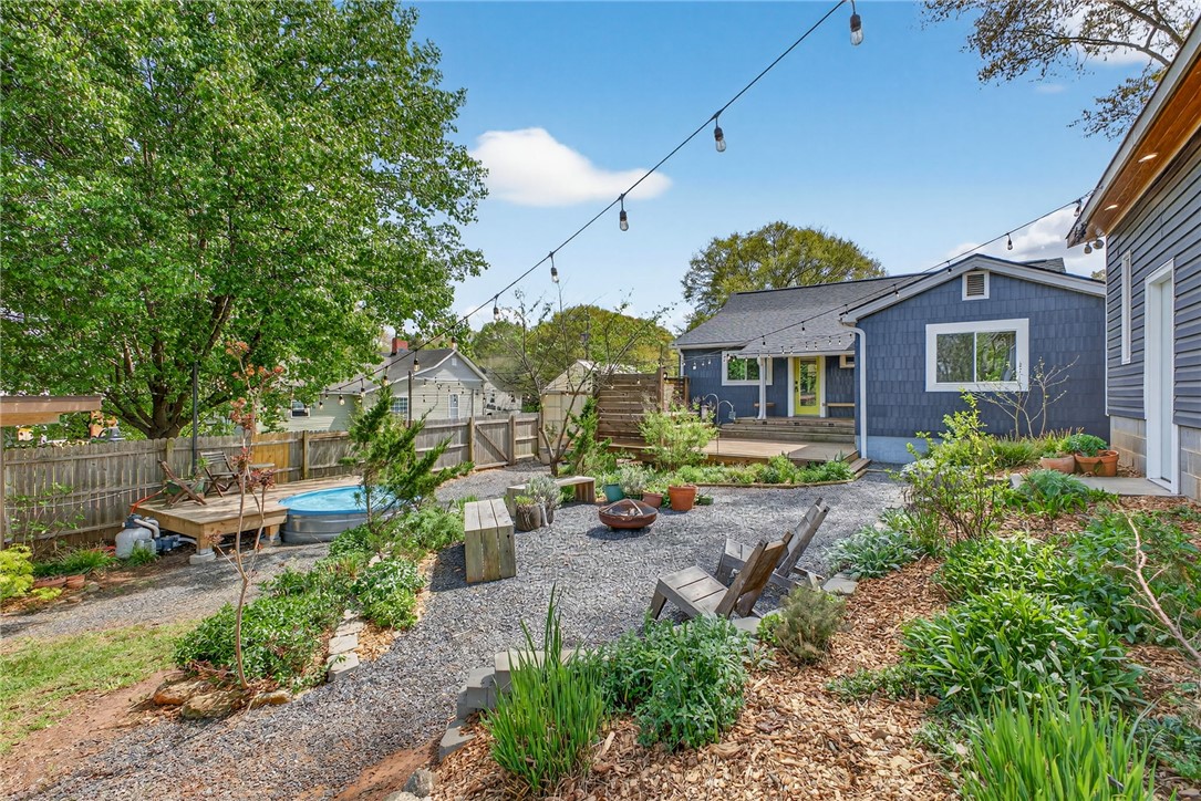 21 Haynes Street Piedmont, SC 29673 - Photo 25 of 35 This outdoor space features a private yard with a pool, deck, and ample room for relaxation and entertaining.