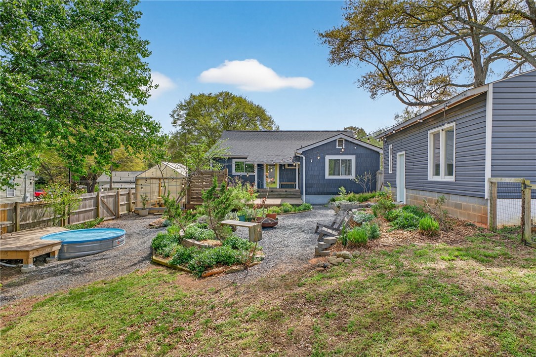 21 Haynes Street Piedmont, SC 29673 - Photo 26 of 35 This charming residence offers a peaceful backyard oasis perfect for relaxation and outdoor enjoyment.