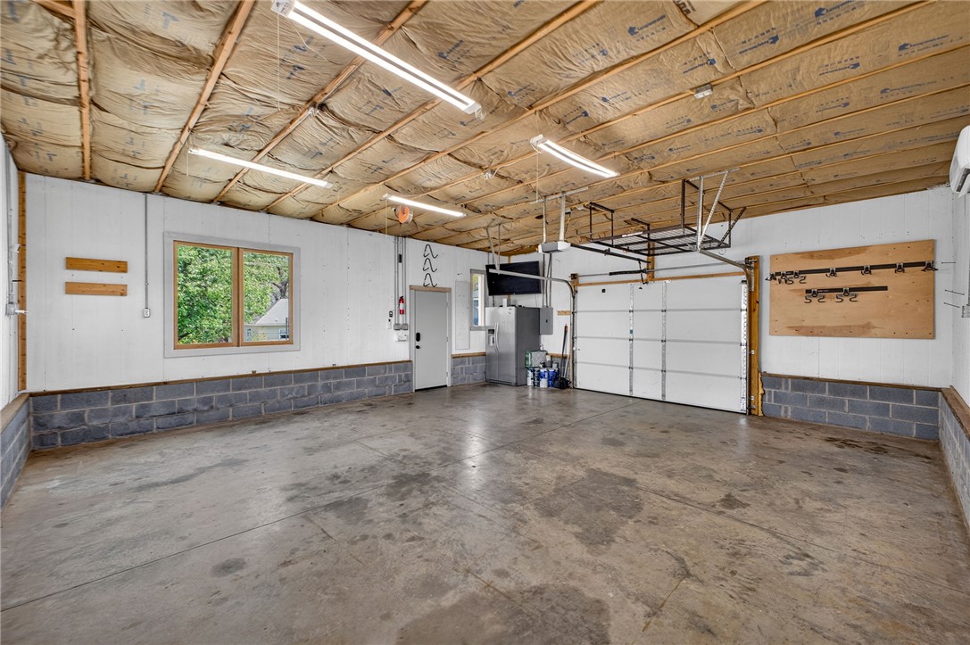 21 Haynes Street Piedmont, SC 29673 - Photo 28 of 35 This spacious garage offers practical utility and ample room for storage or projects.