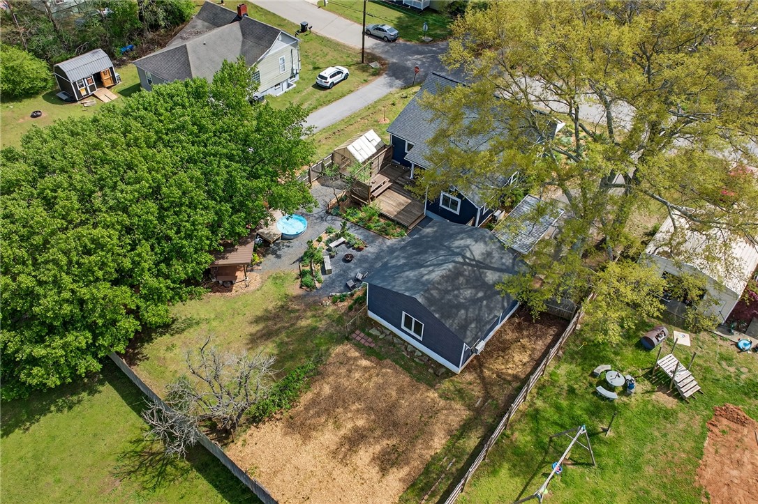21 Haynes Street Piedmont, SC 29673 - Photo 31 of 35 An aerial view showcases a residential property with lush landscaping and outdoor amenities.