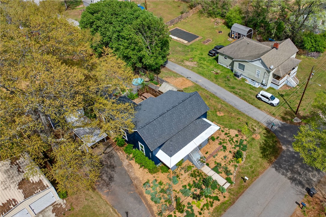 21 Haynes Street Piedmont, SC 29673 - Photo 33 of 35 This charming home features a well-maintained exterior with mature trees and a spacious yard.