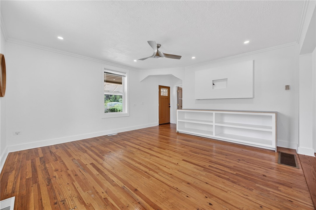 21 Haynes Street Piedmont, SC 29673 - Photo 6 of 35 This inviting living space features gleaming hardwood floors and ample natural light.