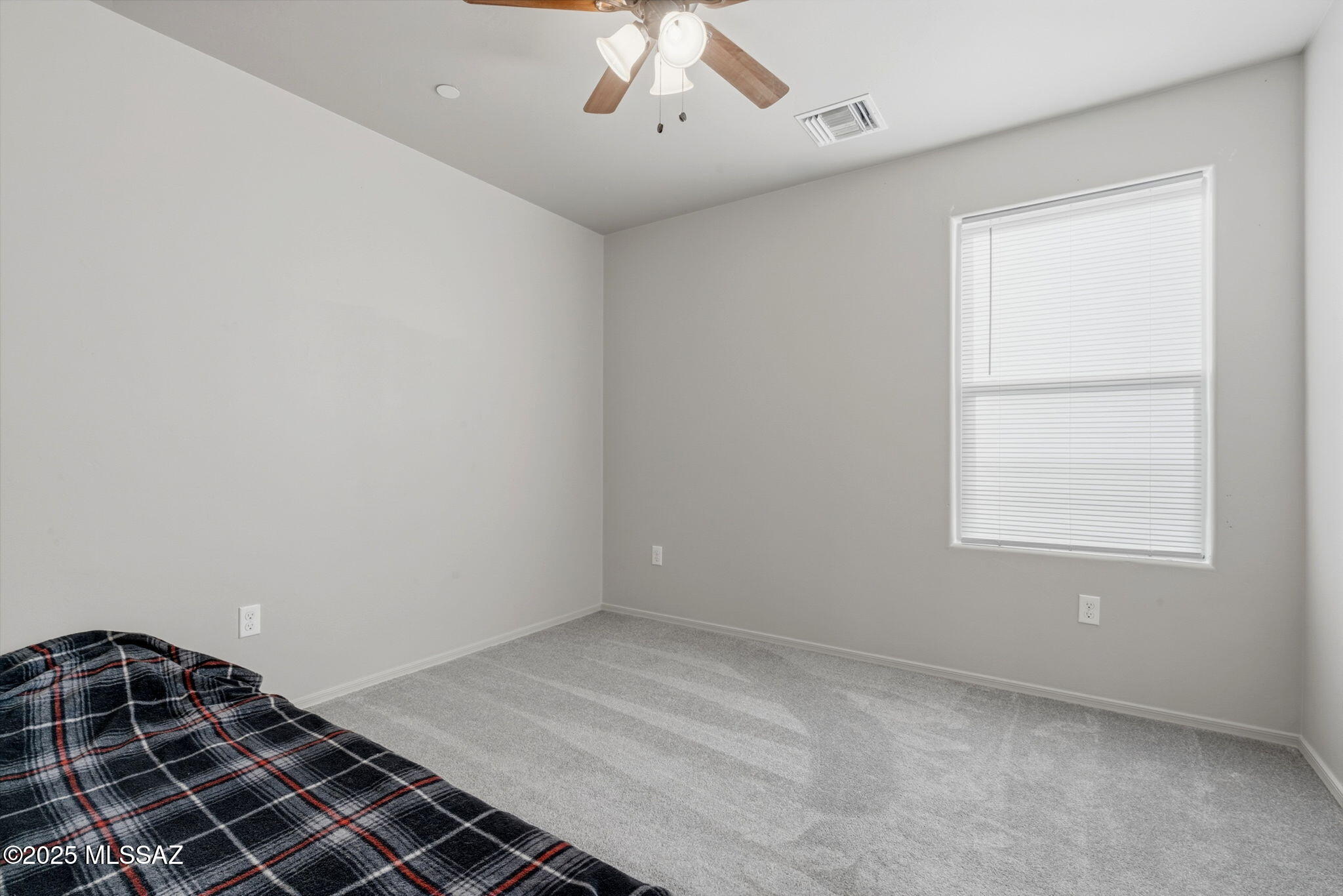 1458 North Wentworth Road Vail, AZ 85641 - Photo 15 of 44 an empty room with a window