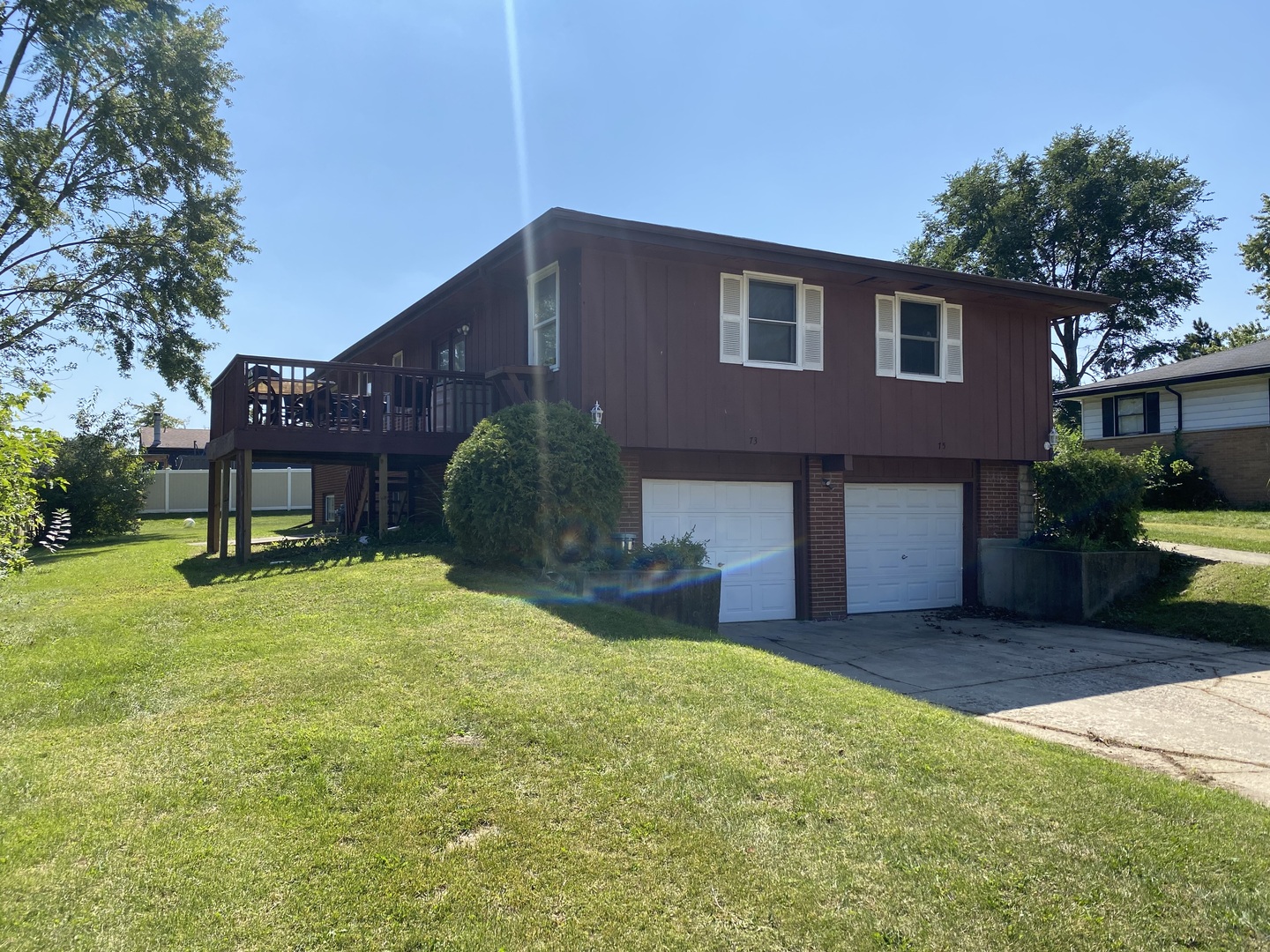 73-75 Neil Road Sugar Grove, IL 60554 - Photo 1 of 4 a house view with a garden space