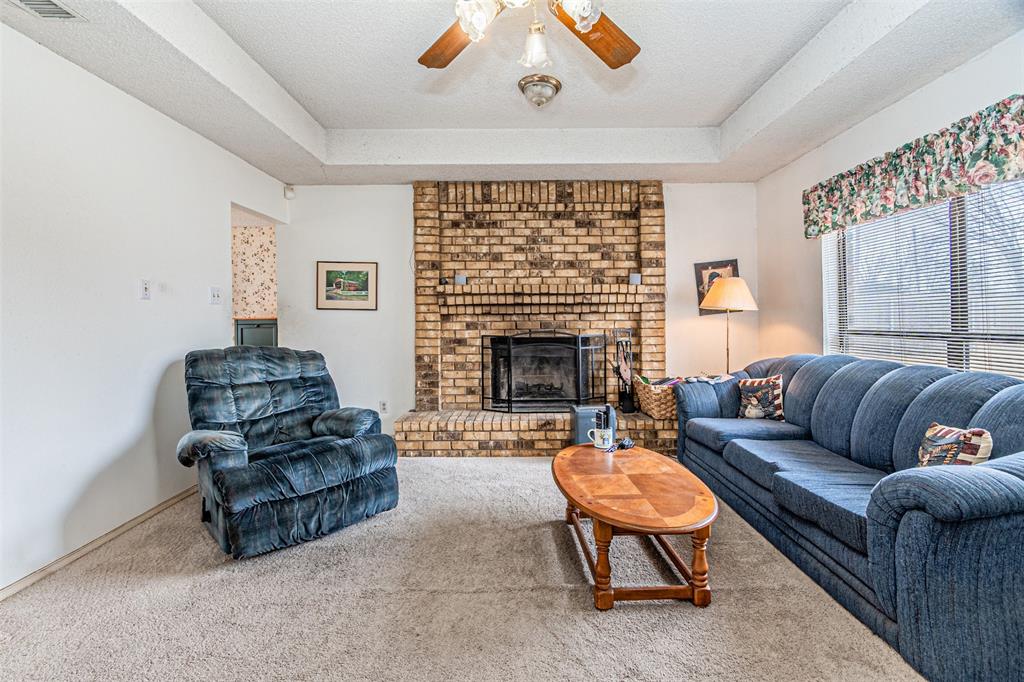 108 Cole Road Red Oak, TX 75154 - Photo 13 of 30 a living room with furniture and a fireplace