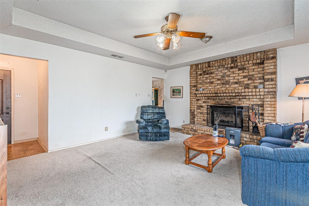 108 Cole Road Red Oak, TX 75154 - Photo 14 of 30 a living room with furniture and a fireplace