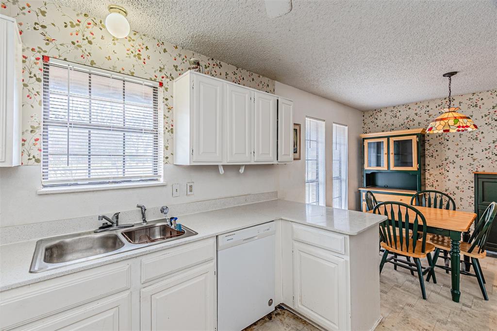 108 Cole Road Red Oak, TX 75154 - Photo 18 of 30 a kitchen with stainless steel appliances granite countertop a sink and cabinets