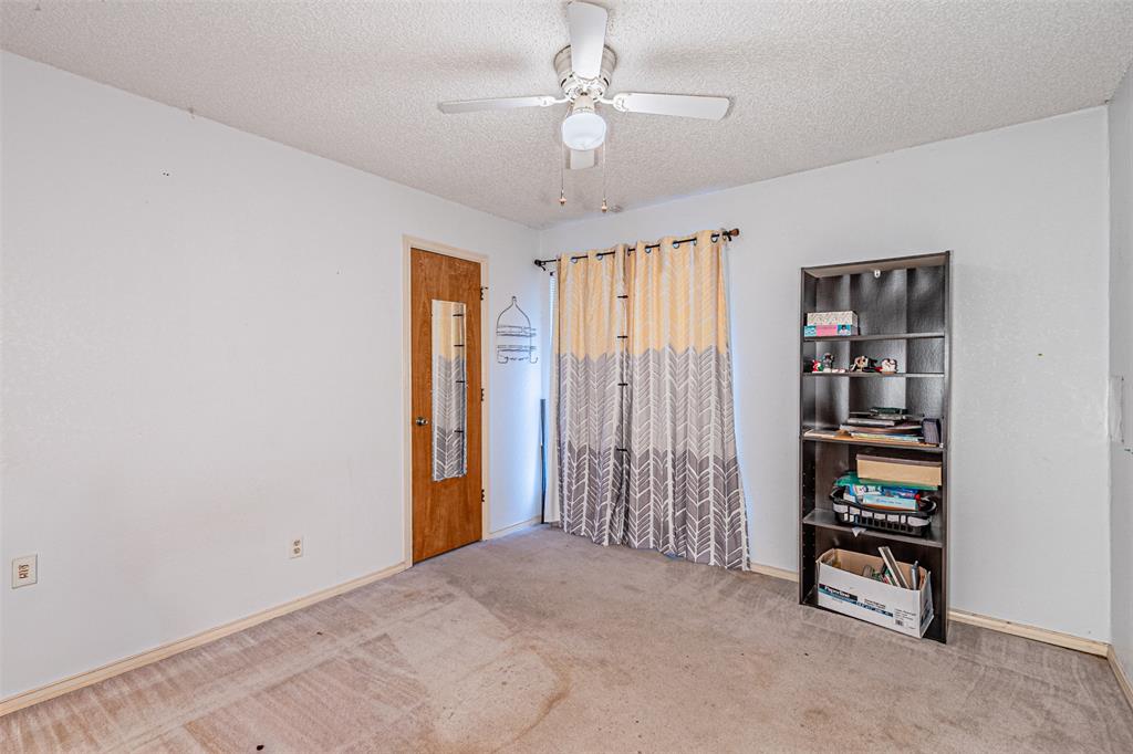 108 Cole Road Red Oak, TX 75154 - Photo 25 of 30 a view of an empty room with closet and racks