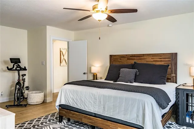a view of a house with swimming pool and sitting area