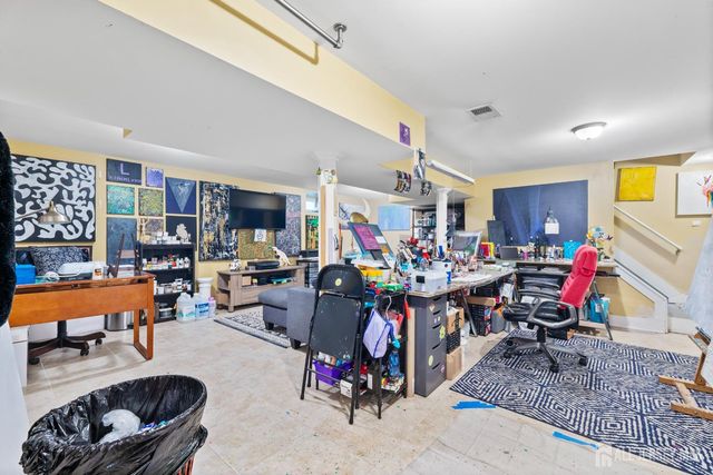 a view of a room with lots of furniture and lots of furniture