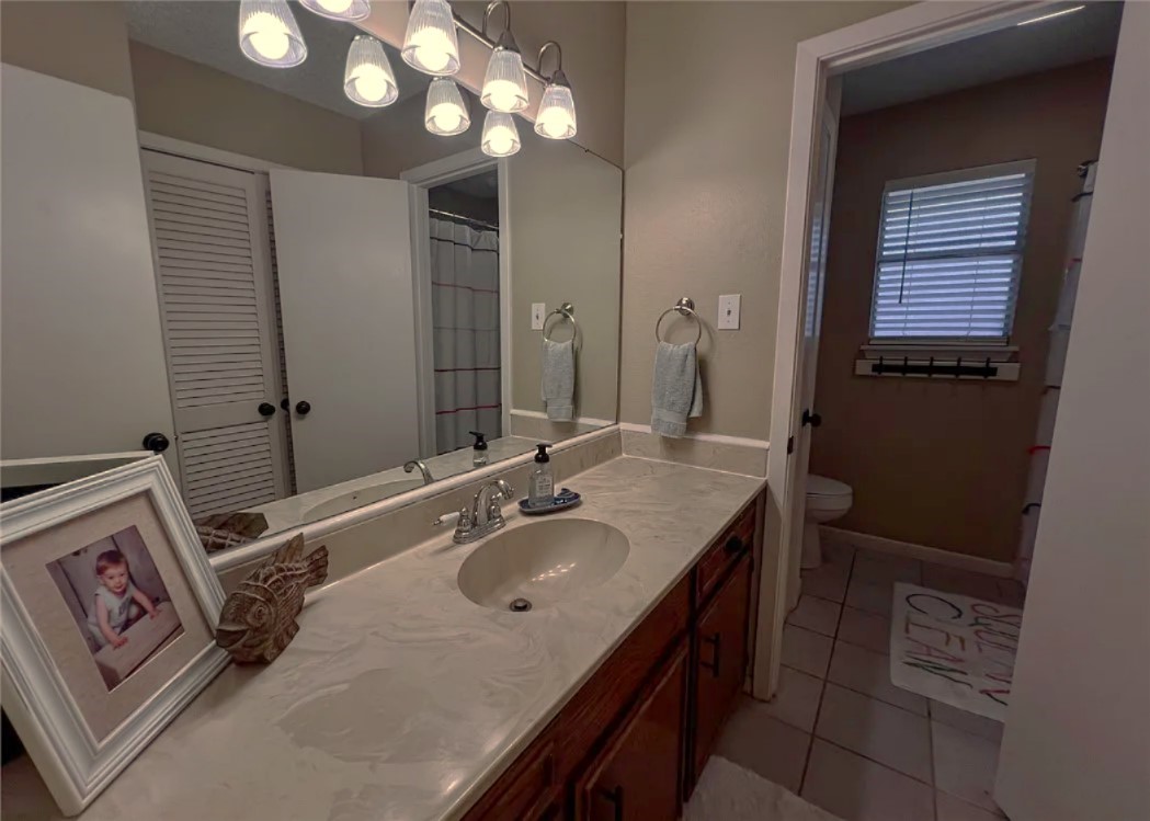 418 Seco Drive Portland, TX 78374 - Photo 22 of 32 a bathroom with a sink vanity and a mirror