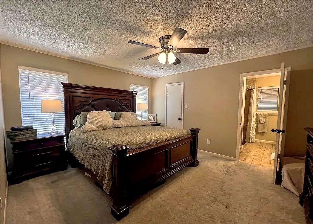 418 Seco Drive Portland, TX 78374 - Photo 24 of 32 a bedroom with a bed and a chandelier