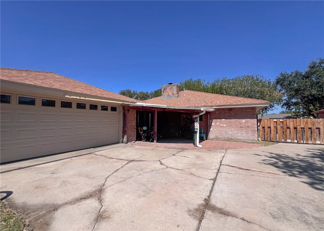 418 Seco Drive Portland, TX 78374 - Photo 32 of 32 a front view of a house with a yard and garage