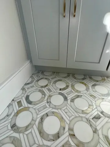 a spacious bathroom with a double vanity sink and a mirror