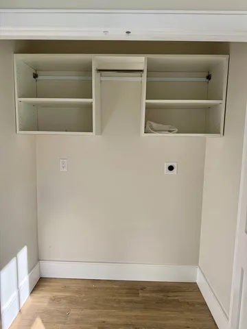 a bedroom with a bed and a chair