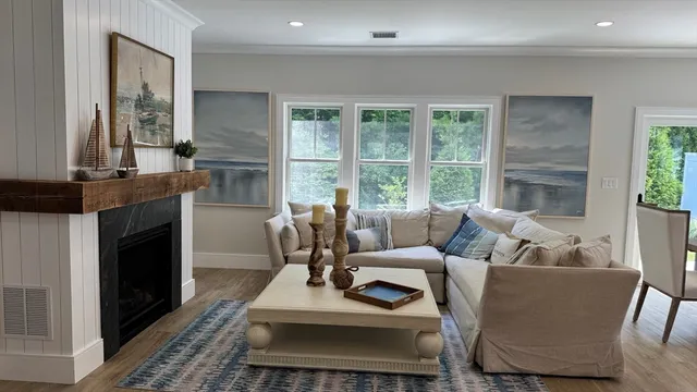 a living room with furniture and a fireplace