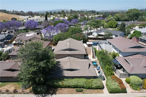 an aerial view of residential houses with outdoor space