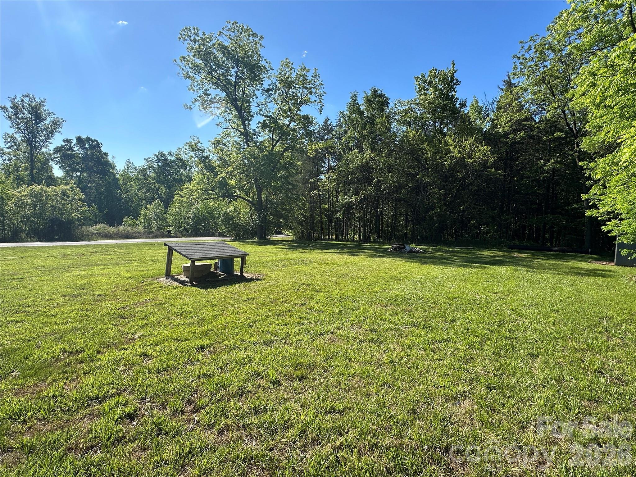 0 Bonkin Lake Road, Unit 3 Mocksville, NC 27028 - Photo 2 of 9 a swimming pool with wooden fence