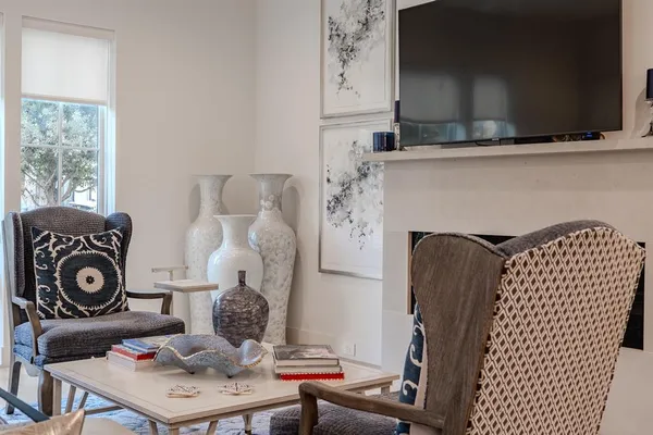 a living room with furniture and a fireplace