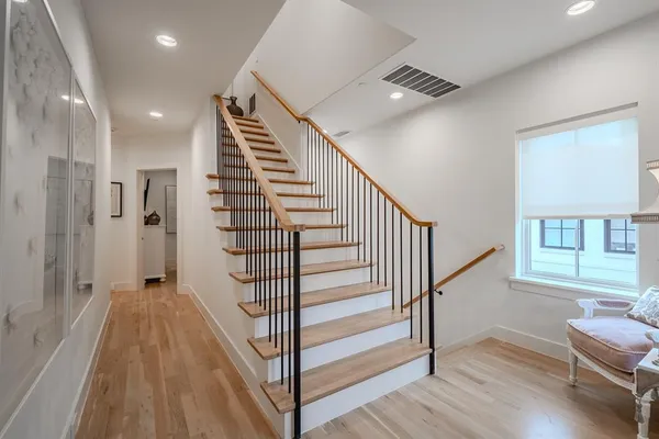 a view of entryway with wooden floor and stairs