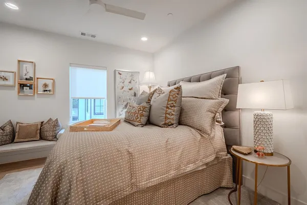 a bedroom with bed and a lamp