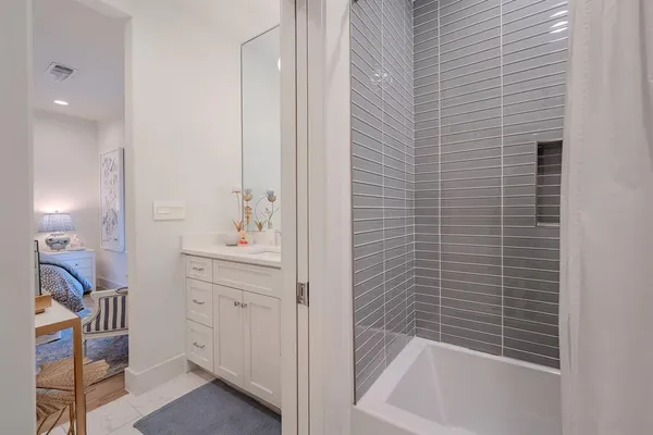 a bathroom with a bathtub and a sink