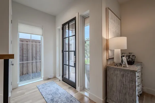 a view of a hallway with front door