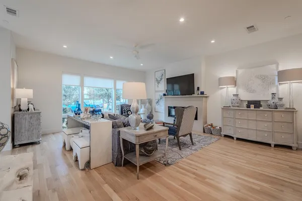a living room with furniture flat screen tv and a fireplace