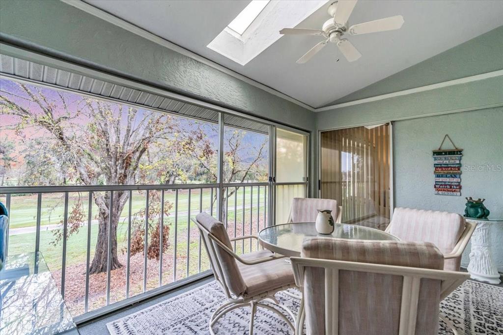 6713 Stone River Road, Unit 206 Bradenton, FL 34203 - Photo 29 of 58 a dining room with furniture window and outside view