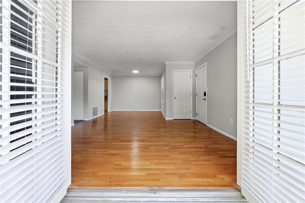 1150 Collier Road Northwest, Unit 4C Atlanta, GA 30318 - Photo 19 of 27 a view of a room with a wooden floor