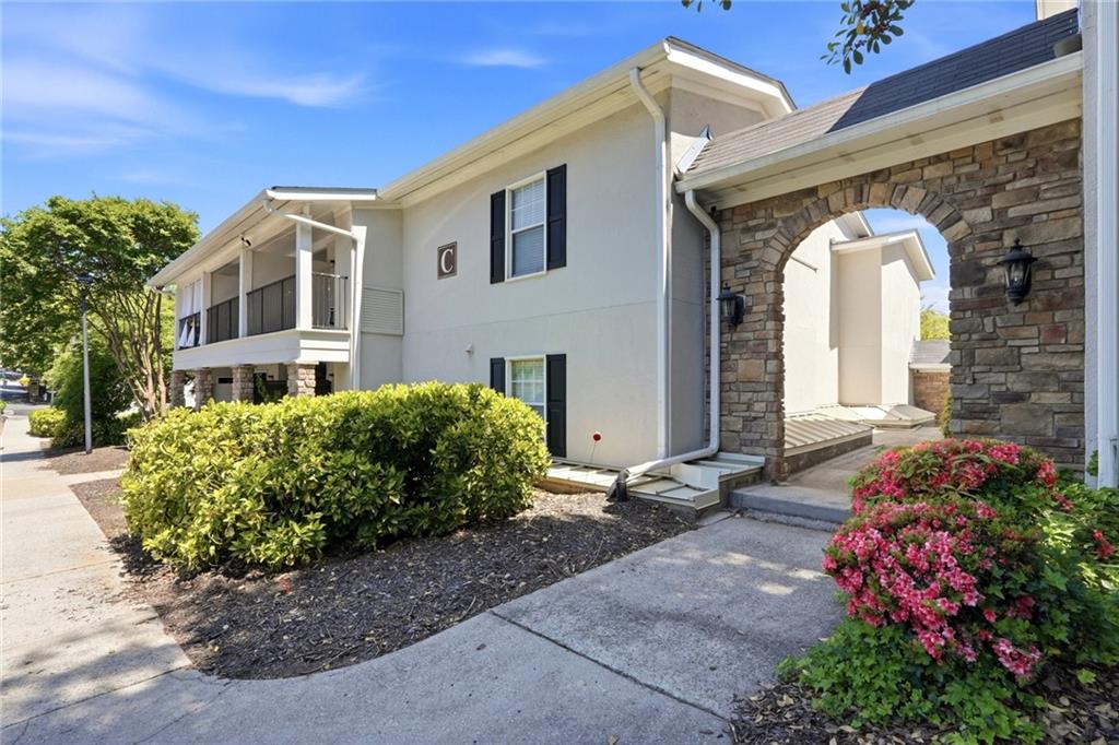 1150 Collier Road Northwest, Unit 4C Atlanta, GA 30318 - Photo 22 of 27 a front view of a house