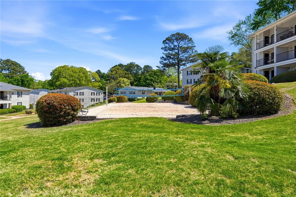 1150 Collier Road Northwest, Unit 4C Atlanta, GA 30318 - Photo 23 of 27 a view of a garden with a slide