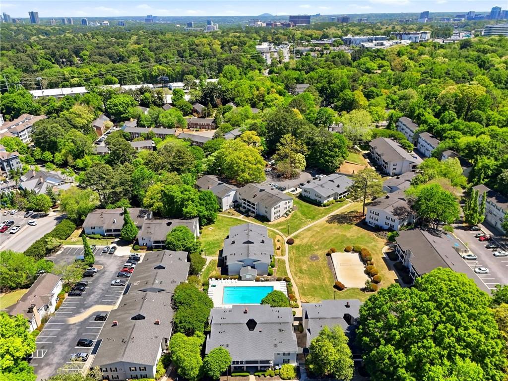 1150 Collier Road Northwest, Unit 4C Atlanta, GA 30318 - Photo 27 of 27 an aerial view of residential houses with outdoor space and trees
