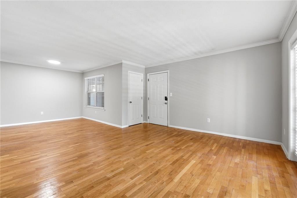 1150 Collier Road Northwest, Unit 4C Atlanta, GA 30318 - Photo 6 of 27 a view of an empty room and window