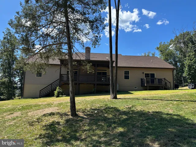 a kitchen with granite countertop cabinets and black appliances