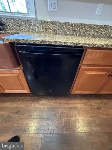 a bathroom with a sink vanity and mirror