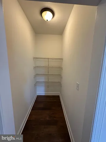 a view of staircase with white walls