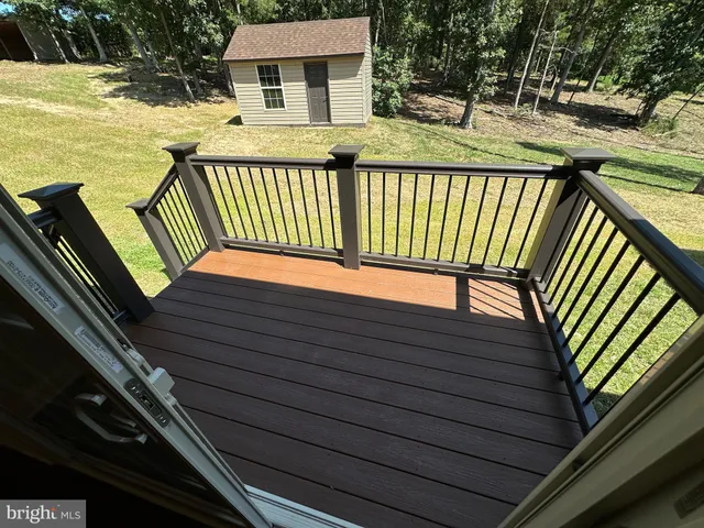 a bathroom with a granite countertop sink and mirror