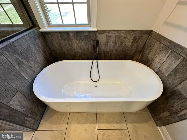 an empty room with wooden floor