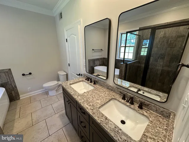 a view of an empty room with wooden roof